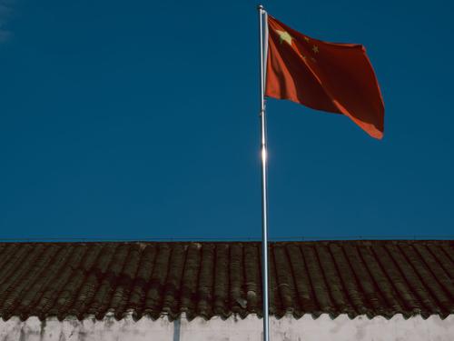NVIDIA's Political Tax: Why China Chip Sales and Insider Selling Signal a Capped Ascent